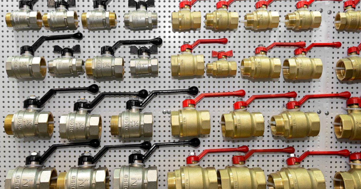 A display structure showcasing several options of industrial stainless steel ball valves of different sizes.